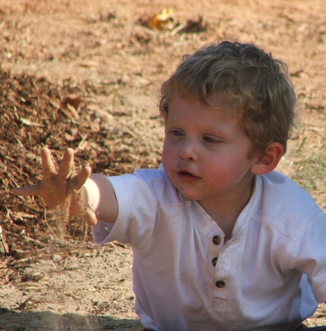 Boy plays in dirt