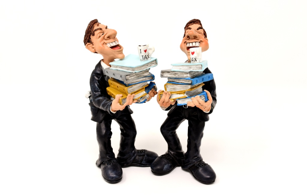 Caricature of two smirking tax consultants carrying piles of papers, on top of which each has a mug saying 'I love tax'
