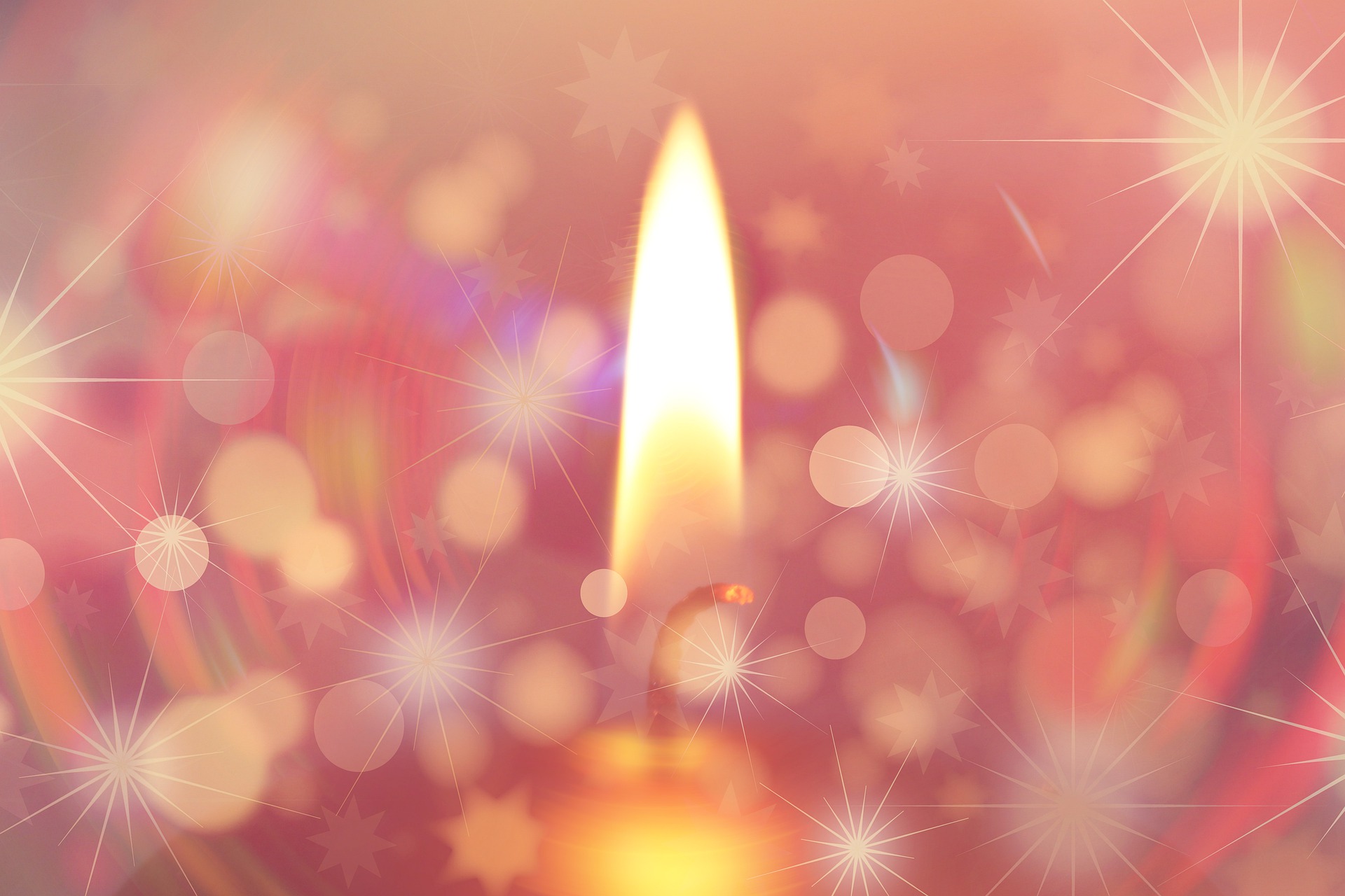 A candle flame is centred on a pink background. There are many other smaller sparkling lights around. At the top right is the big light of the sun.