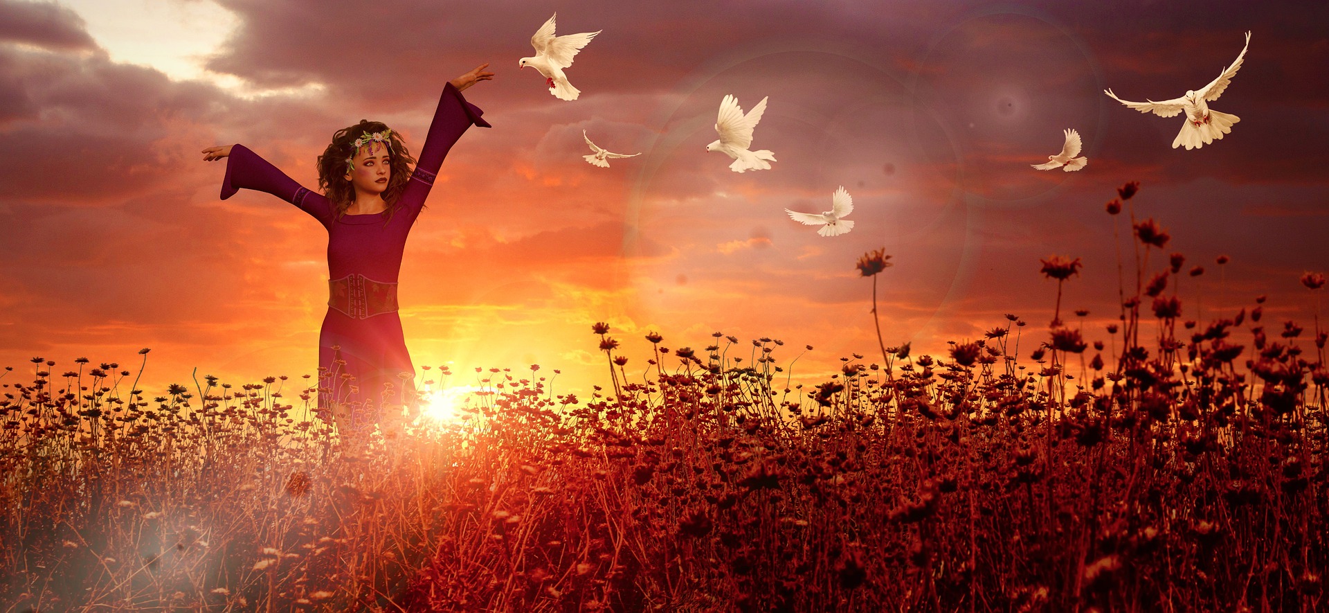 A woman in a mystical long red dress and hairband of flowers is walking through a field of flowers. The sun is rising or setting. Her arms are raised out to the side at shoulder height. Many white doves are fluttering near her. She  is singing to them?