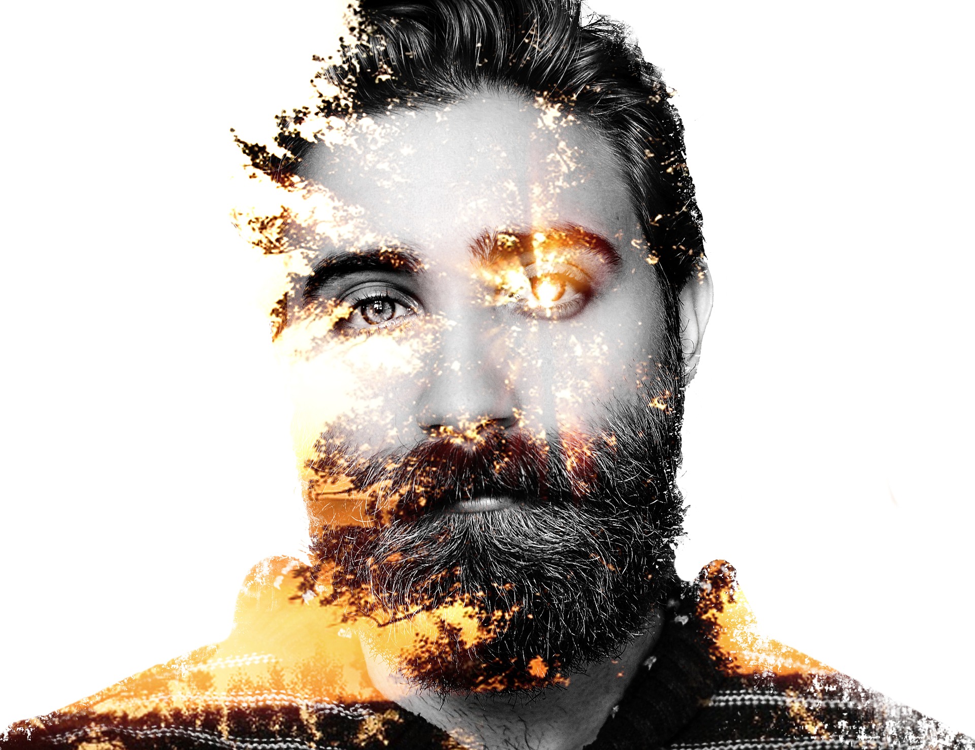 A bearded man has sunlight appearing to emerge from his face, eyes, hair, skin. We see his head and shoulders against a white background.